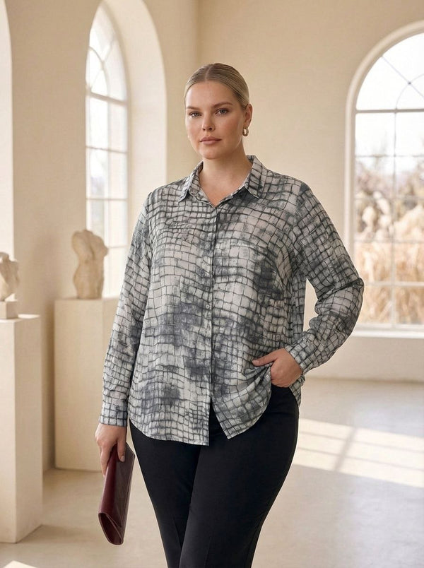 Earth-tone patterned satin crepe blouse for plus sizes by HANEZZA, featuring a relaxed fit and elegant design.